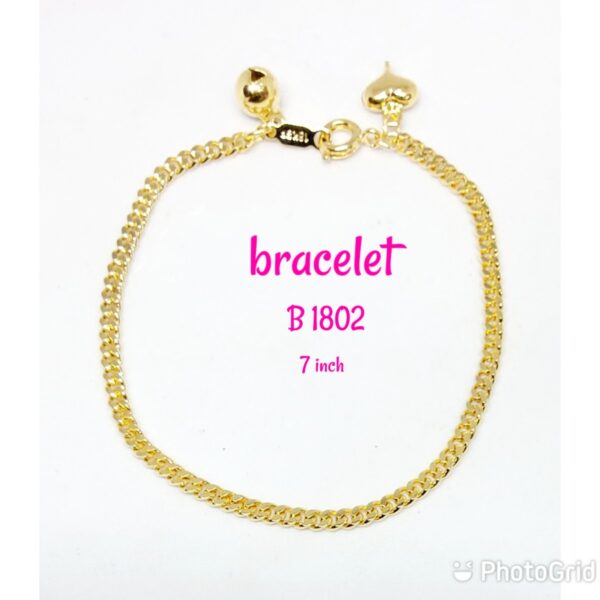 Gold plated plain bracelet with dangling bell and heart.