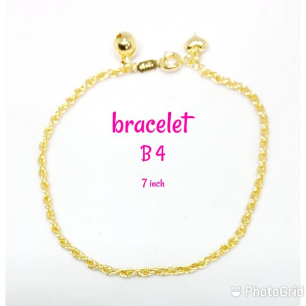 Gold plated rope design bracelet with dangling bell and heart.