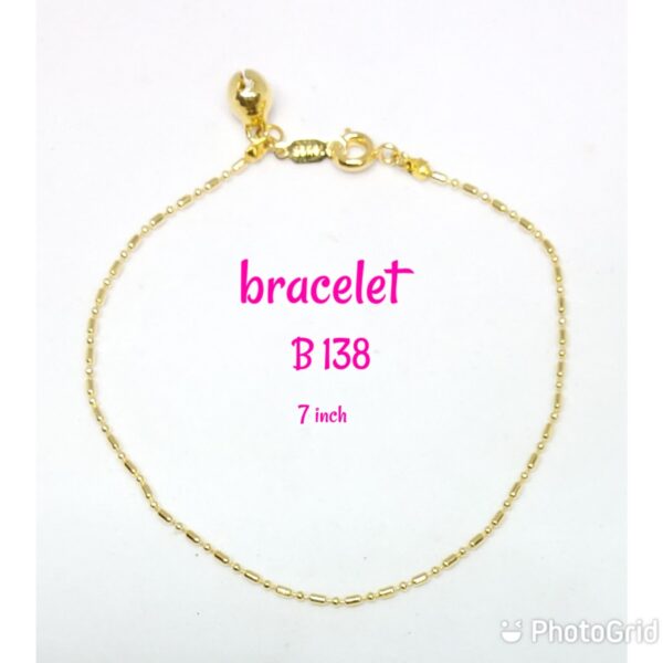 Gold plated plain design bracelet with dangling bell.