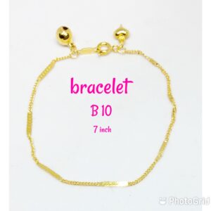 Gold plated pattern design bracelet with dangling bell and heart.