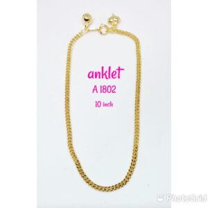 Gold plated anklet with dangling bell and heart.