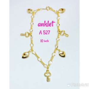 Gold plated anklet with dangling keys and hearts.
