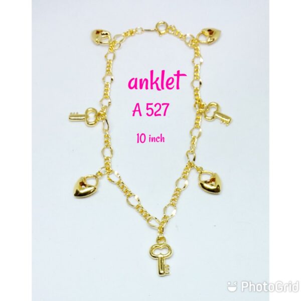 Gold plated anklet with dangling keys and hearts.