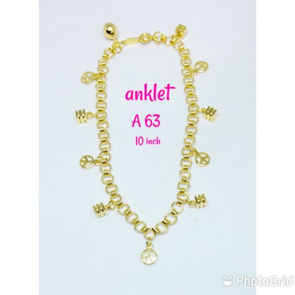 Gold plated anklet with dangling cubes and peace signs with dangling bell.