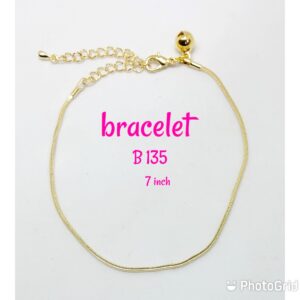 Gold plated plain shining bracelet with dangling bell.