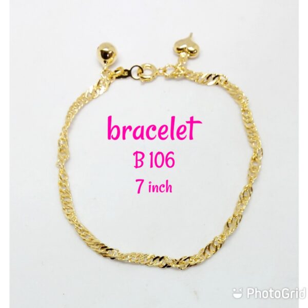 Gold plated wave design shining bracelet with dangling bell and heart.