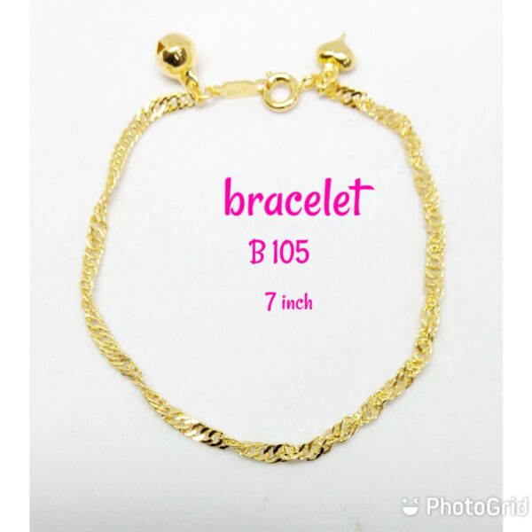 Gold plated thinner shining bracelet with dangling bell and heart.