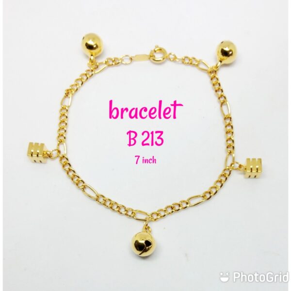 Gold plated pattern bracelet with dangling loud bells and big cubes.